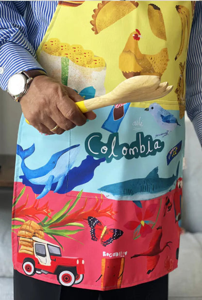 Delantal cocina ilustrada con símbolos colombianos en ambiente tropical — empanada, mazorca, café, gansito y jet - decoración kit de regalo colombiano, íconos colombianos ilustrados, regalo para colombianos en el exterior,Colombian icons gift, mandil, regalo cultural colombiano, regalo gastronómico. Ailé